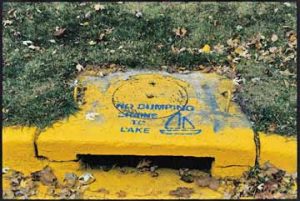 storm sewer labeled to discourage dumping