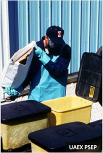 Applicator loading pesticide dust from a bag