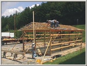 Workers framing a storage building 