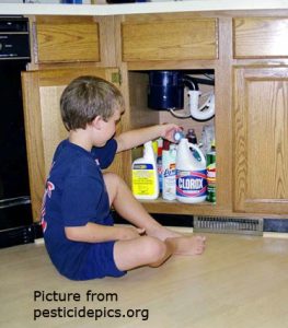 child playing with pesticides 2